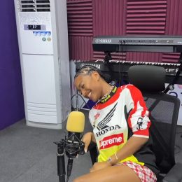 Ayra Starr smiling during a radio interview at Ultima Studios