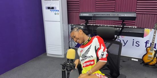 Ayra Starr smiling during a radio interview at Ultima Studios