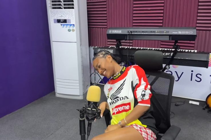 Ayra Starr smiling during a radio interview at Ultima Studios
