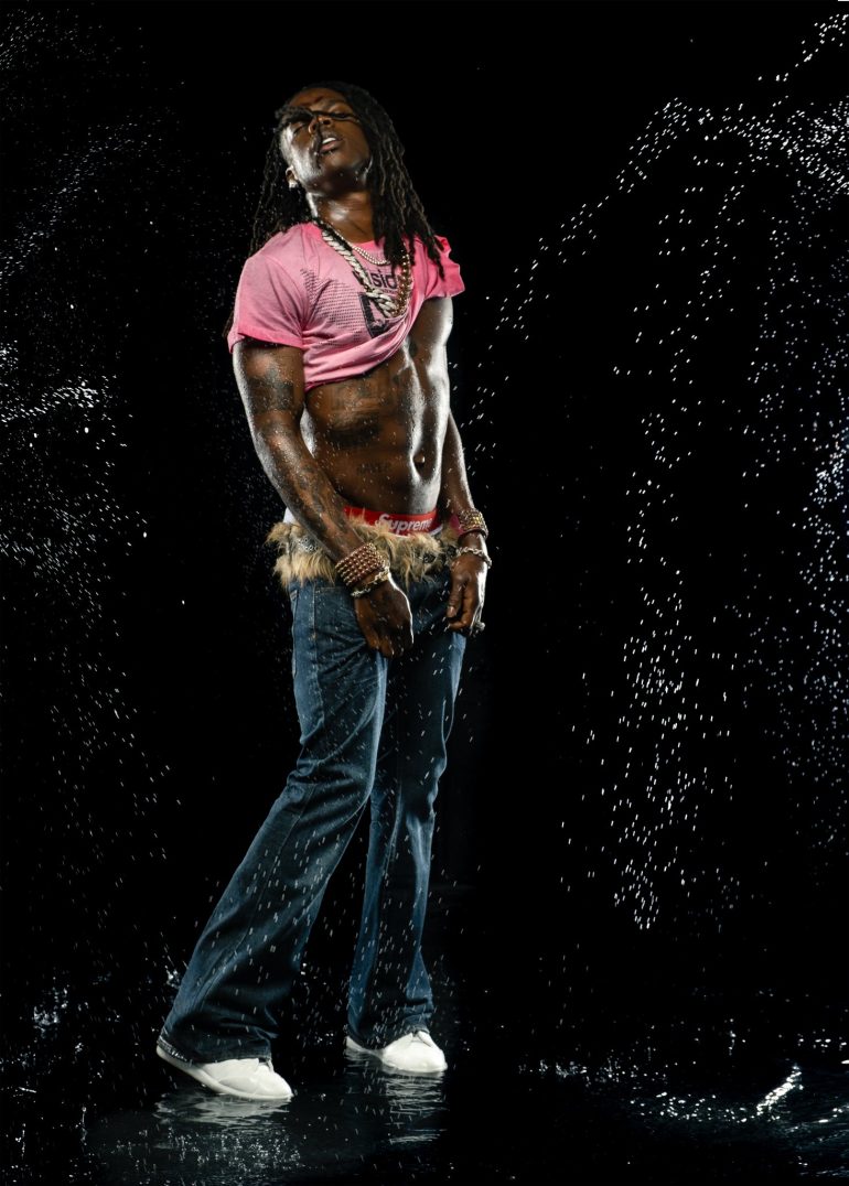 Rema in a studio water portrait.