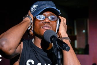 Victony in BBC Radio 1Xtra Live Lounge with headphones and microphone