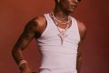 Wizkid performing with microphone