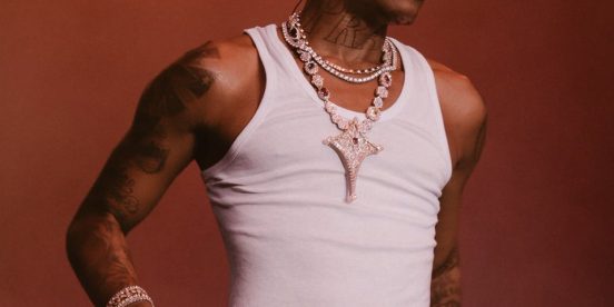 Wizkid performing with microphone