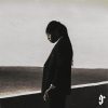 FOLA "9" album cover: FOLA in a dark suit with his head bowed against a pale sky, a gothic "9" in the corner.