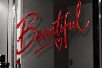 Phyno 'Beautiful' single cover: the title written in red lipstick on a bathroom mirror.