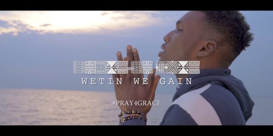Victor AD praying in the official Wetin We Gain music video