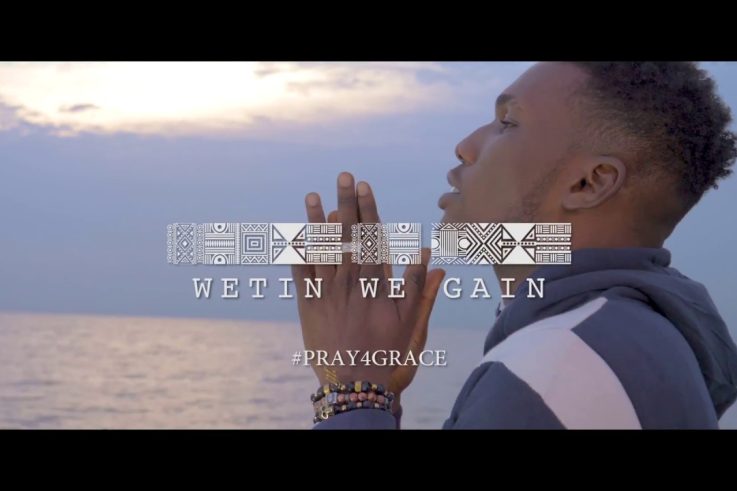 Victor AD praying in the official Wetin We Gain music video